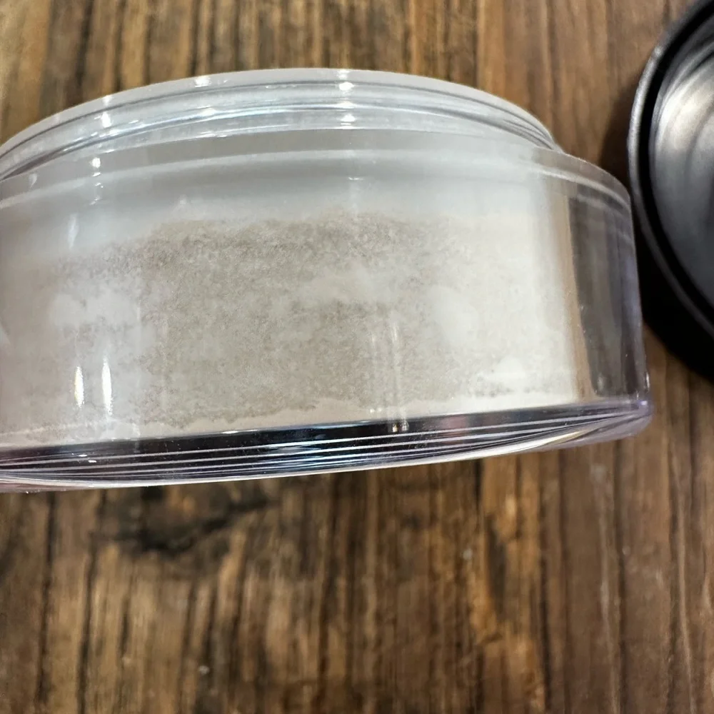 Charlotte Tilbury Magic Powder - Deep Brown Lid with Pale Pink Text